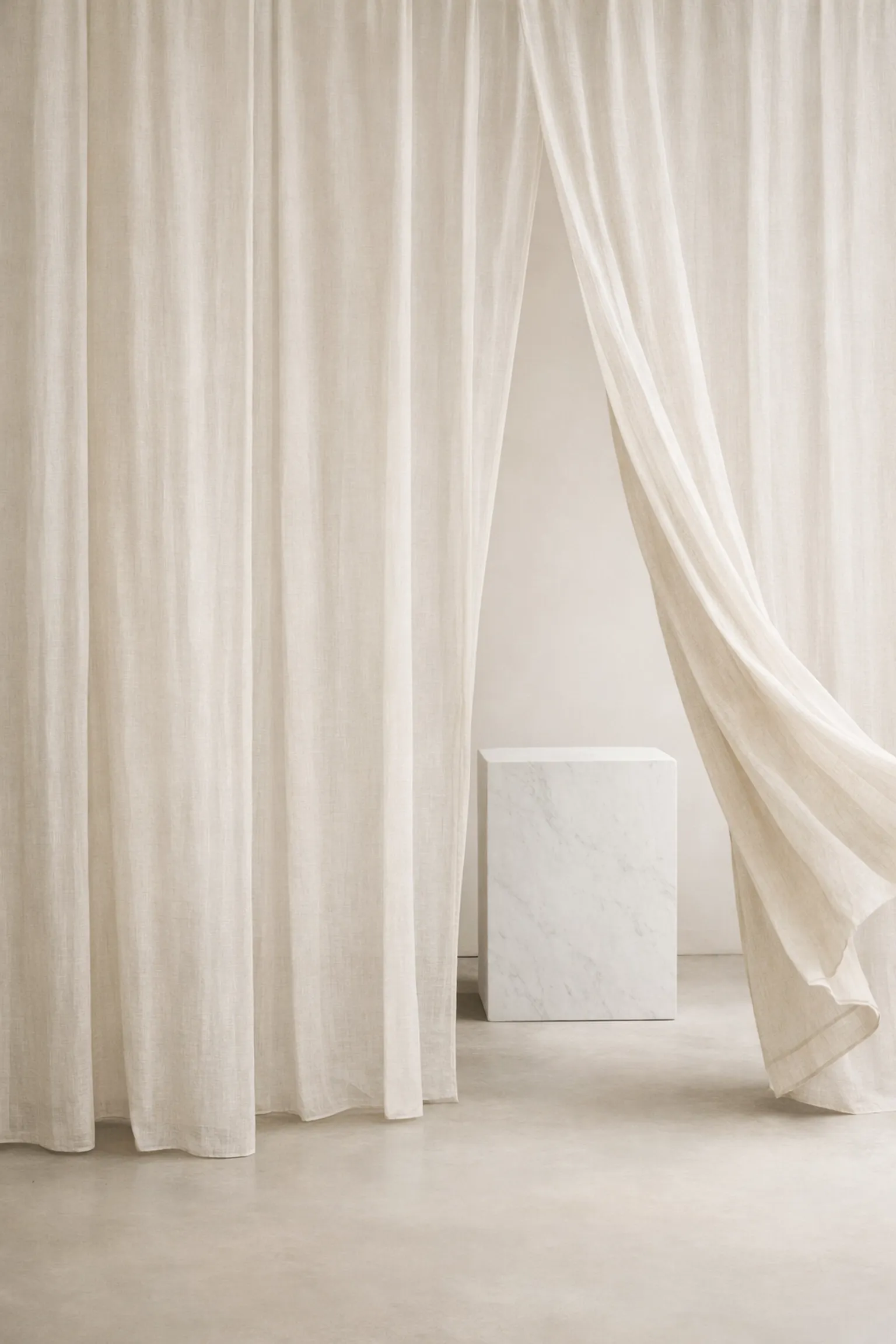 Translucent fabric layers pulled aside to reveal a marble base, symbolizing the clinical dismantling of identity scripts.